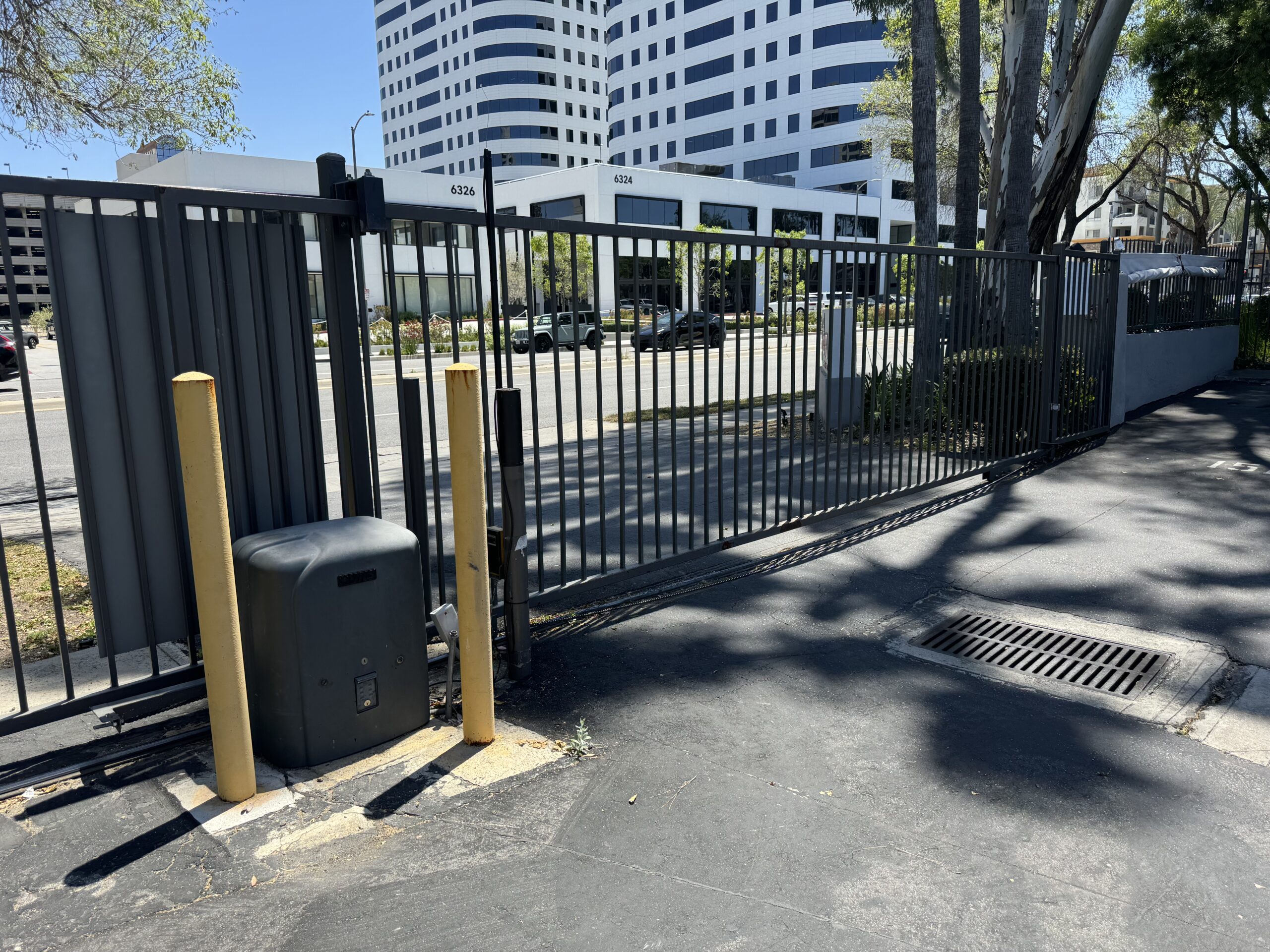 Apartment building driveway sliding gate
