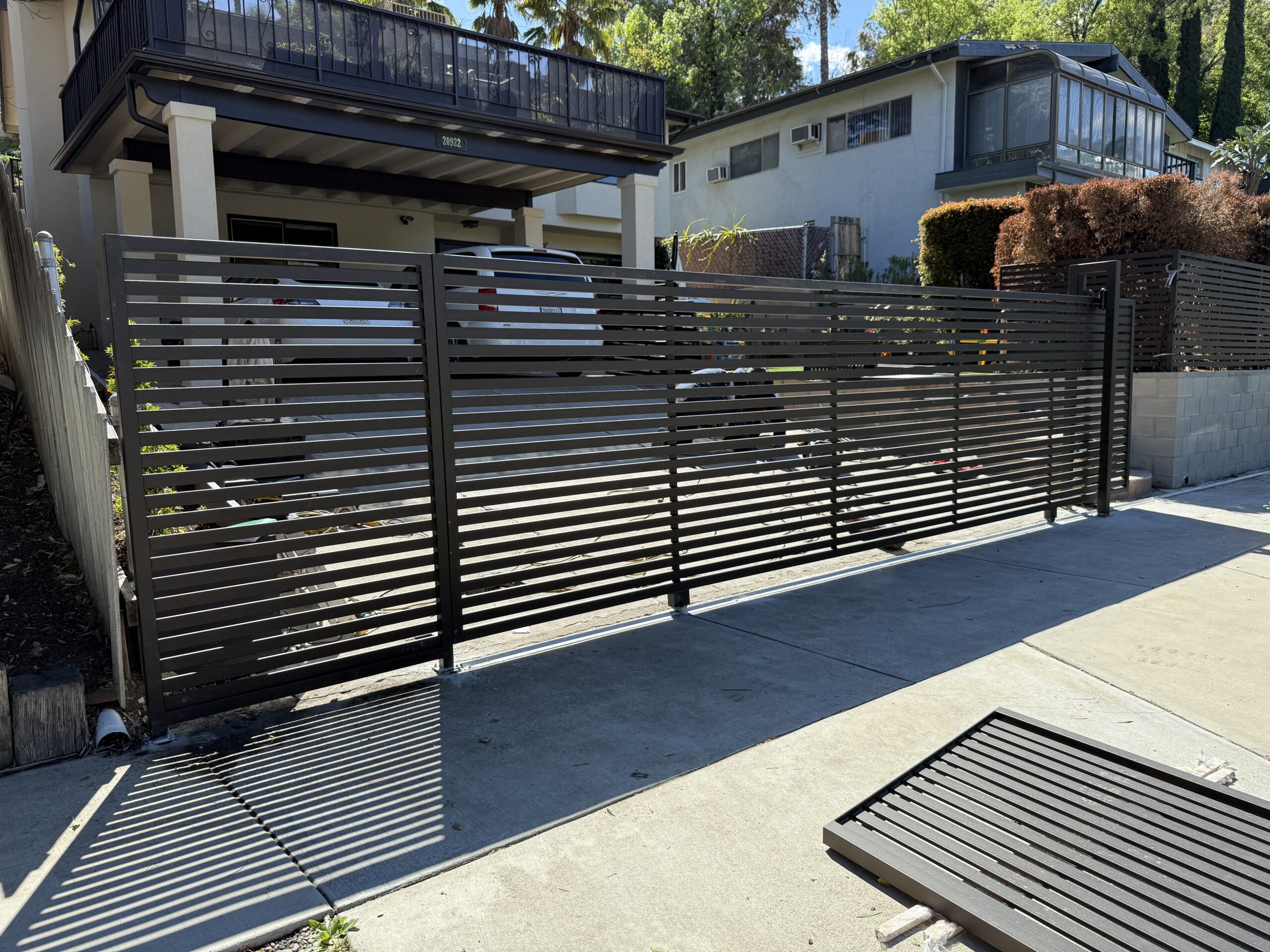 Modern slatted gate in driveway Woodland Hills