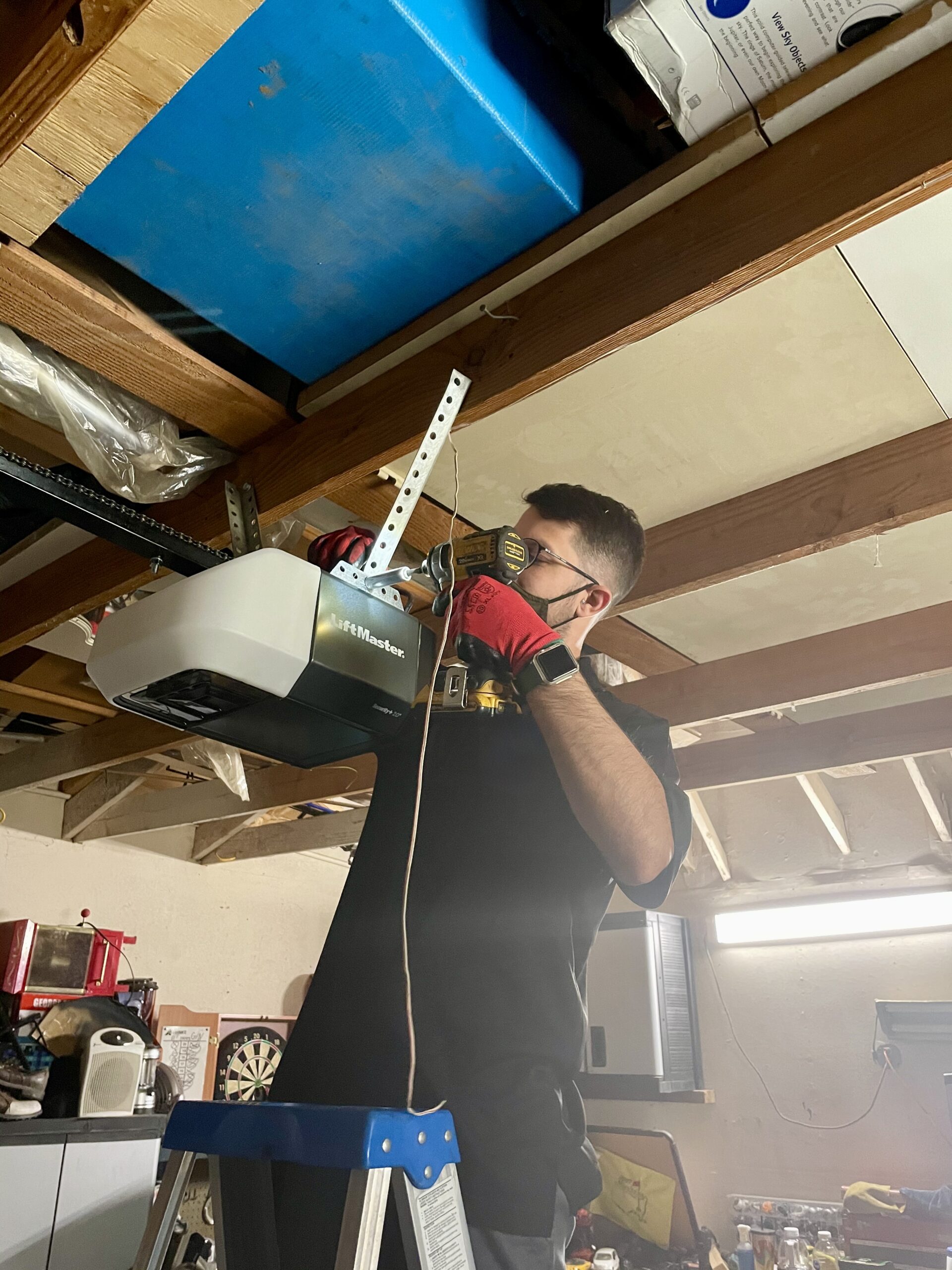 Technician is installing garage door opener