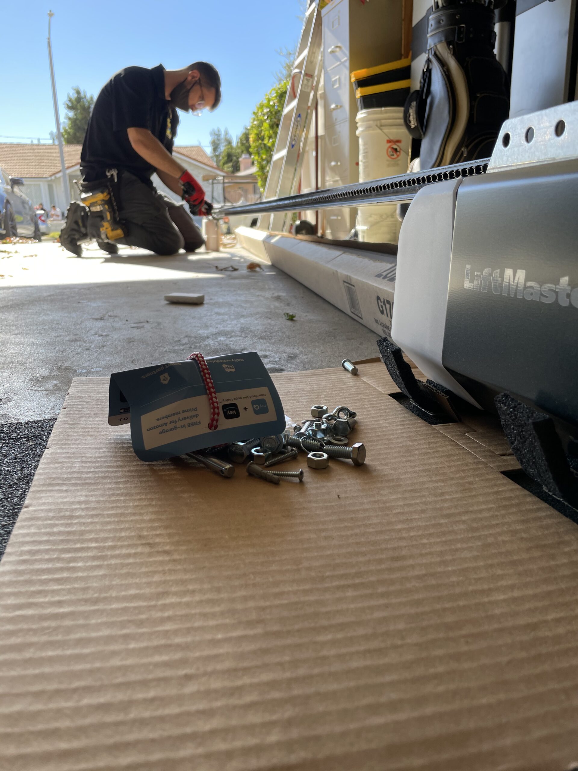 technician instaling a new garage door opener