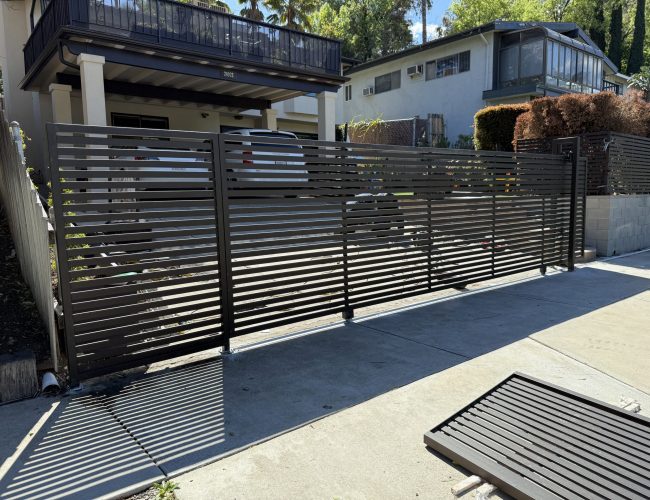 Modern slatted gate in driveway Woodland Hills